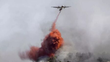 At least one person killed in massive wildfire in southern France