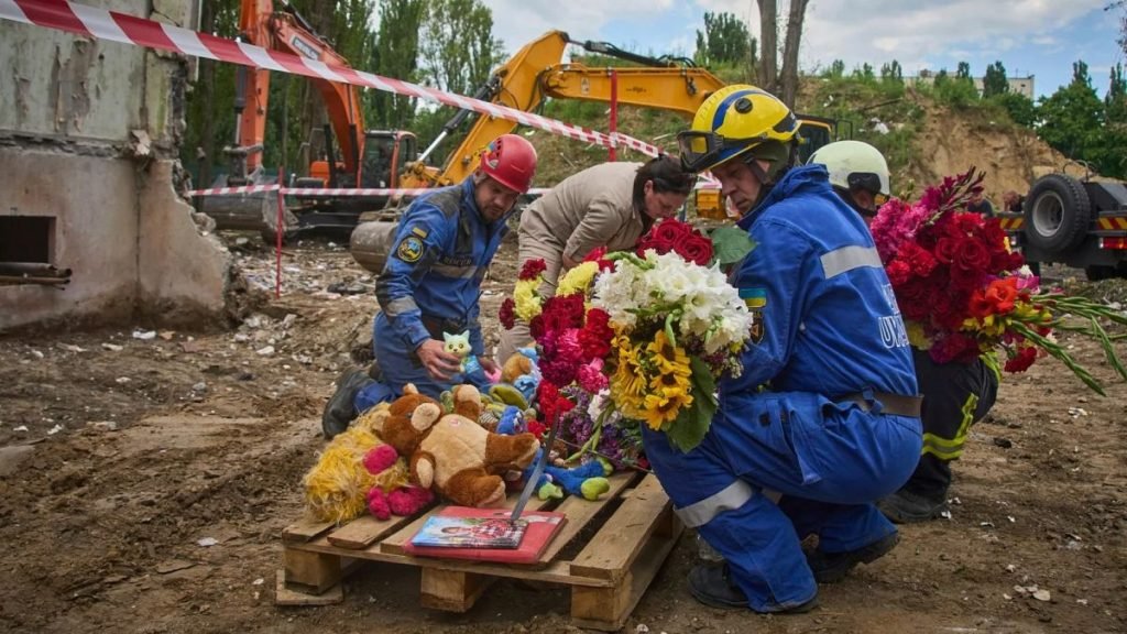 Kyiv holds official day of mourning for 31 killed in Russian strikes