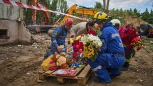 Kyiv holds official day of mourning for 31 killed in Russian strikes
