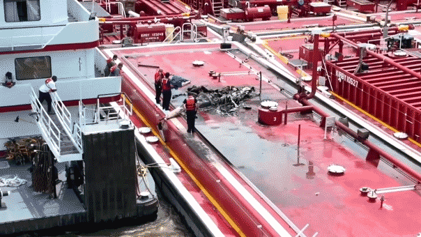 Two people killed after helicopter hits power line and crashes into barge on Mississippi River Two people killed after helicopter hits power line and crashes into barge on Mississippi River