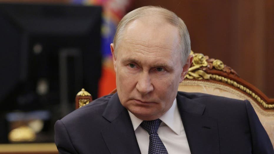 Russian President Vladimir Putin listens during a meeting at the Kremlin