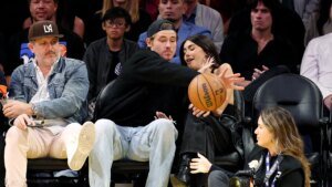 Justin Herbert goes viral for saving Madison Beer from flying basketball at Lakers game amid romance rumors Justin Herbert goes viral for saving Madison Beer from flying basketball at Lakers game amid romance rumors
