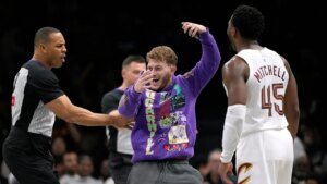 Fan storms court during NBA game seeking selfie with Cavaliers star Donovan Mitchell Fan storms court during NBA game seeking selfie with Cavaliers star Donovan Mitchell