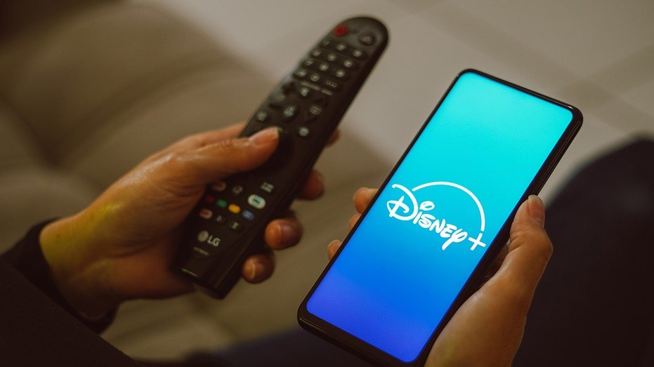 Disney+ logo with a TV remote