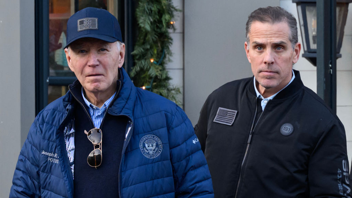 Former President Joe Biden and his son Hunter Biden standing together