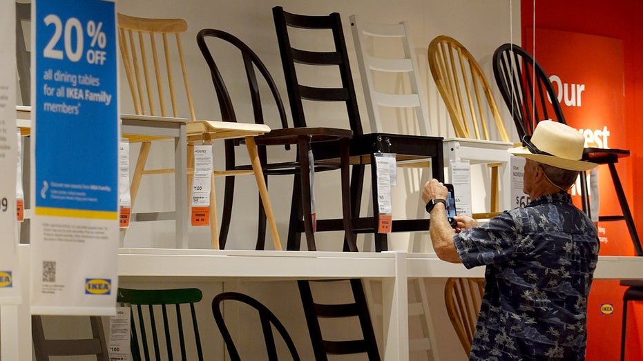 A customer shops for furniture at an IKEA store