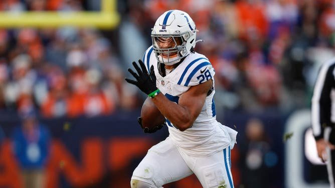 Indianapolis Colts running back Jonathan Taylor runs the ball against the Denver Broncos.