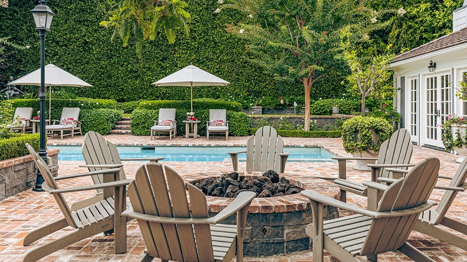 The backyard features a firepit.