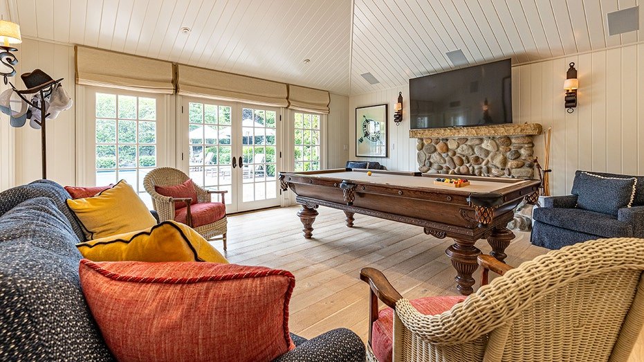 The home also includes a game room with a pool table.