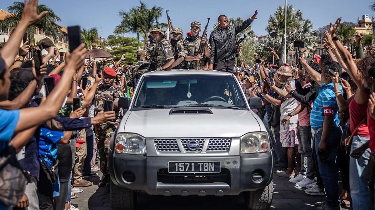 Members of Madagascar CAPSAT army unit surrounded by crowd