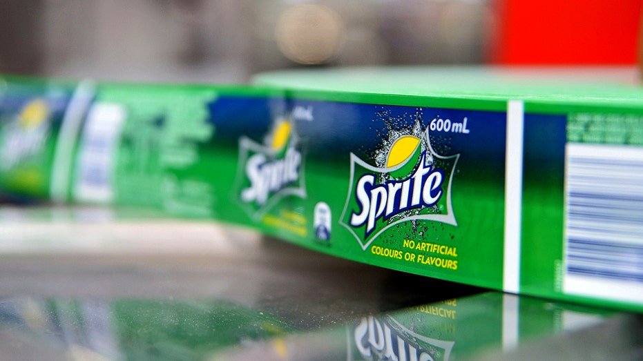 A roll of Sprite labels rotate as bottles are labeled.