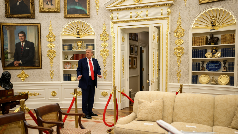 Trump speaks to reporters in the Oval Office