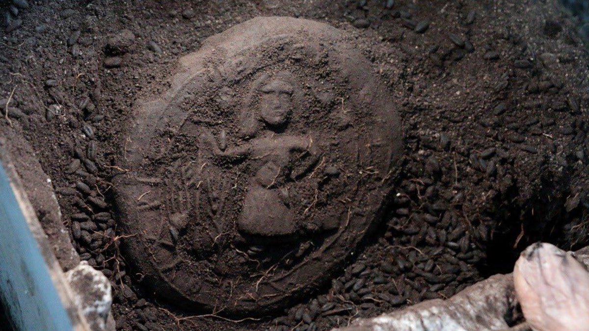 Bread loaf of Jesus in dirt at excavation site