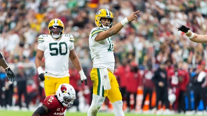 Green Bay Packers QB Jordan Love celebrates a first down vs. the Arizona Cardinals at State Farm Stadium in NFL Week 7. (Photo credit: Mark J. Rebilas-Imagn Images)