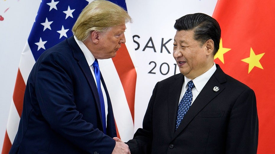 China's Xi Jinping and President Donald Trump shake hands