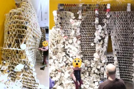 Young girl topples tower made from 63,000 beer coasters created by artist in a bid to break Guinness World Record