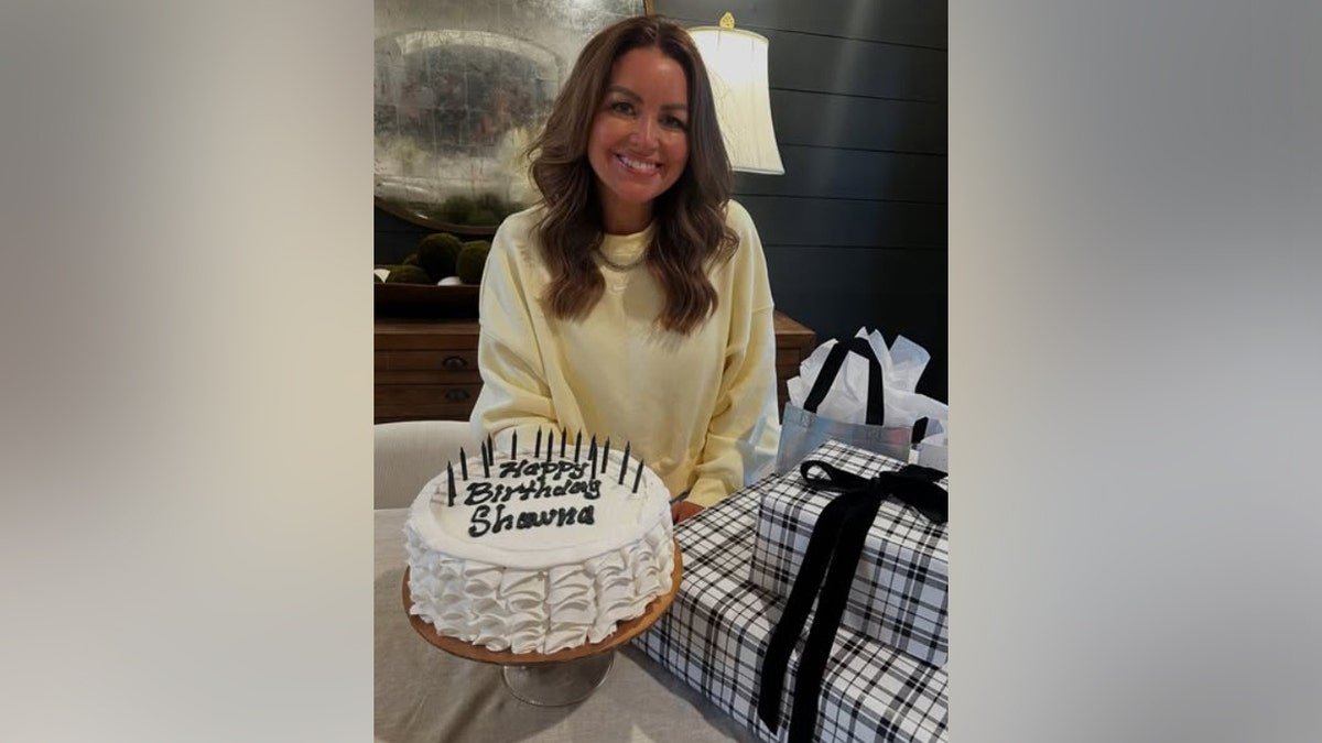 Shawna Collins holding a birthday cake
