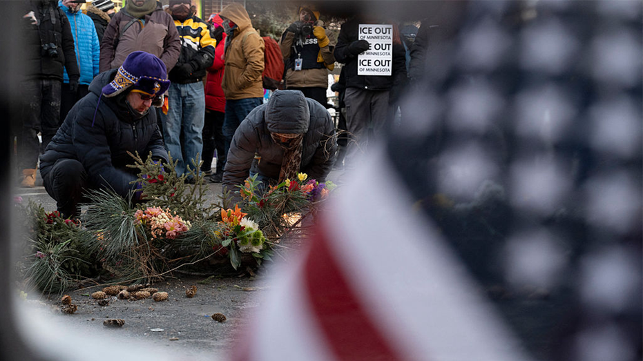 People mourn at a makeshift memorial