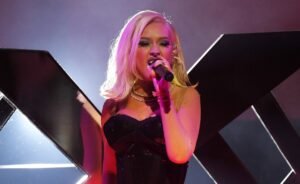 Christina Aguilera Sends Fashion From Paris With Nothing On Above Her Waist But A Necklace & Look Of Business