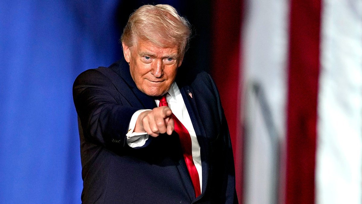 President Donald Trump pointing while onstage