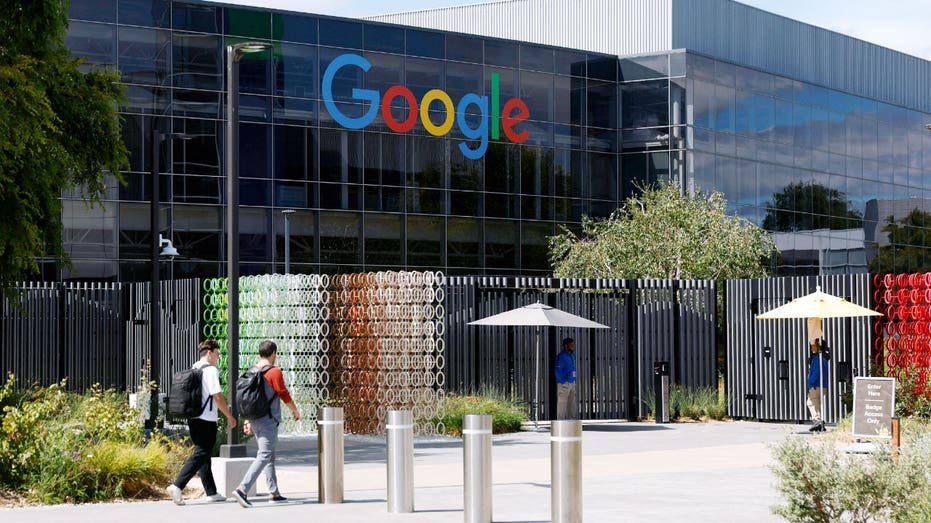 Workers enter a building on the Google headquarters campus on July 23, 2025 in Mountain View, California. Google parent company Alphabet reported better-than-expected second-quarter earnings with revenue of $96.43 billion compared to analyst expectations of $94 billion.
