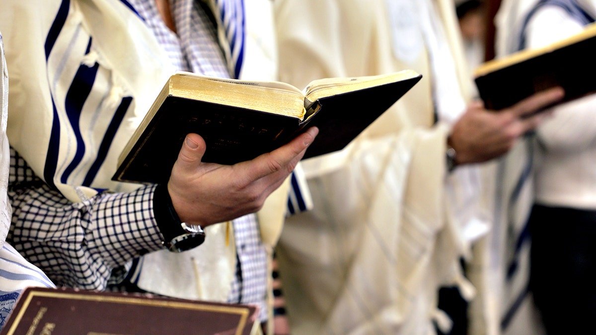 Jewish man wearing a traditional tallit 
