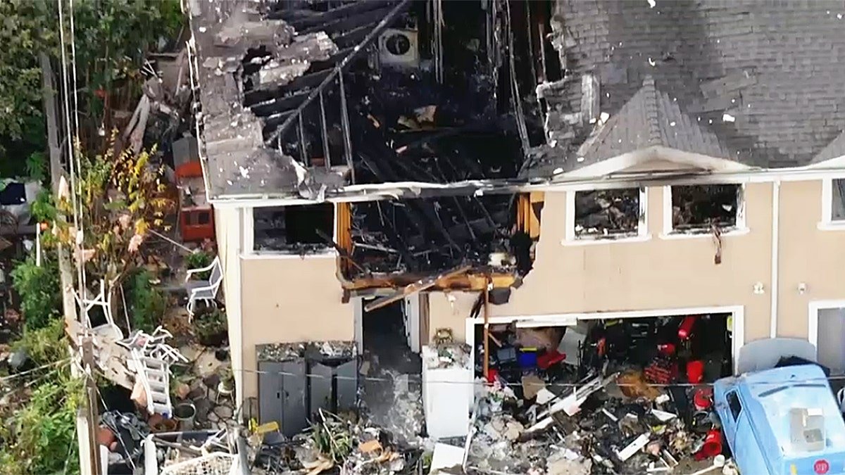 Wreckage and debris outside apartment building in California following explosion