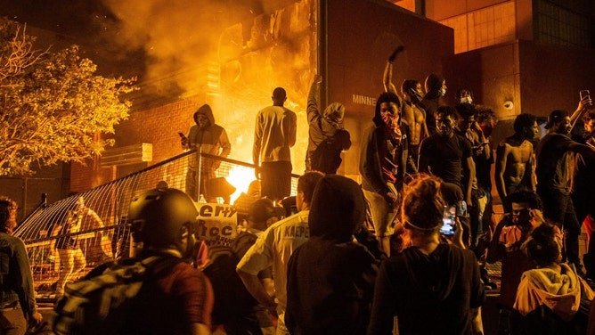 Protesters set the Minneapolis Police 3rd precinct ablaze on Thursday, May 28, 2020. 